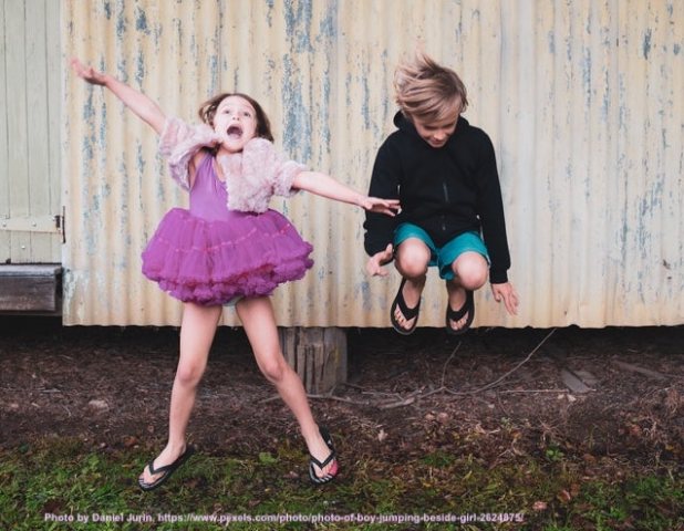 Photo by Daniel Jurin, https://www.pexels.com/photo/photo-of-boy-jumping-beside-girl-2624875/